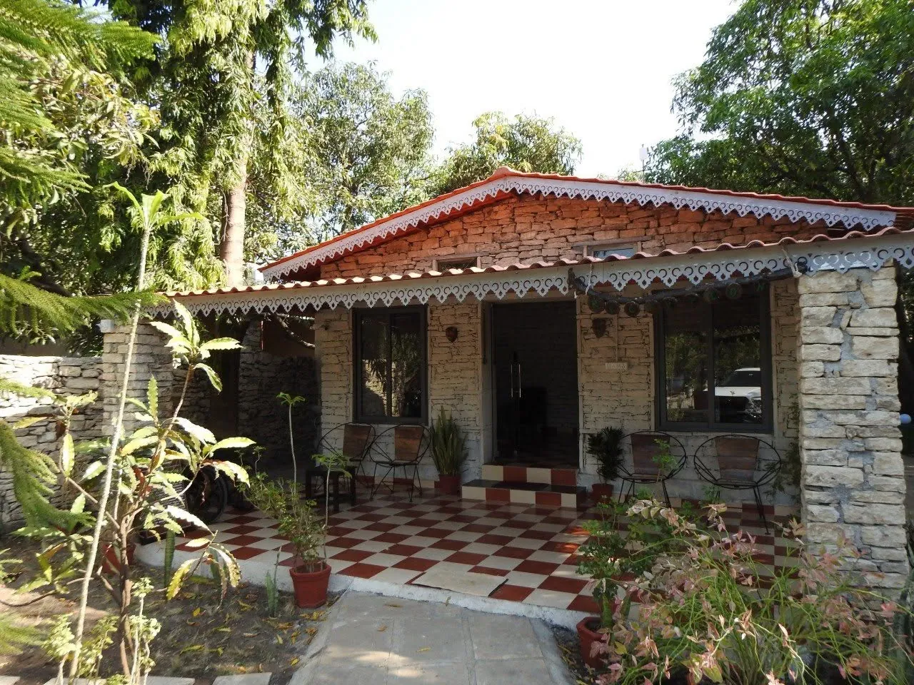 An orchard cottage at Gir Birding Lodge under the mango trees