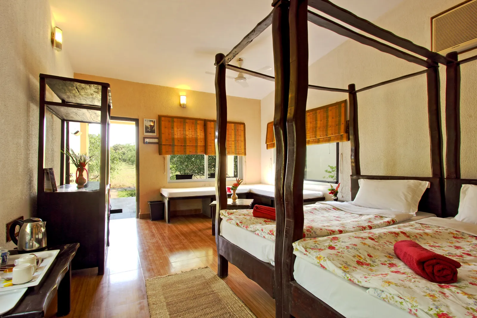 An air-conditioned deluxe room at Gir Birding Lodge